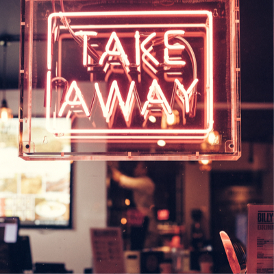 a take away light up sign in a restaurant